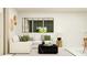 Bright living room featuring a white couch, decorative pillows, modern furniture, and natural lighting at 13539 White Gold Run, Parrish, FL 34219