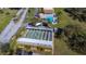 Aerial view of the pool and shuffleboard courts, showcasing community amenities and recreational facilities at 1371 Mission Hills Blvd, Clearwater, FL 33759