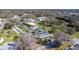 Aerial view showcasing community pool, shuffleboard, and well-maintained landscaping at 1371 Mission Hills Blvd, Clearwater, FL 33759