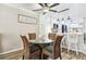 Dining area features a glass-top table and comfortable seating, ideal for Gathering meals and gatherings at 1371 Mission Hills Blvd, Clearwater, FL 33759