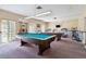 Bright community game room with pool tables and exercise equipment for resident enjoyment at 1371 Mission Hills Blvd, Clearwater, FL 33759