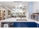 Open kitchen showcasing a functional island overlooking living area for easy entertaining and socializing at 1371 Mission Hills Blvd, Clearwater, FL 33759