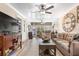 Inviting living room with hardwood floors, ceiling fan and comfortable furnishings, perfect for relaxation at 1371 Mission Hills Blvd, Clearwater, FL 33759