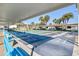 Covered shuffleboard courts for outdoor recreation, complete with benches and lush landscaping at 1371 Mission Hills Blvd, Clearwater, FL 33759