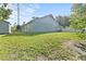 A spacious backyard featuring healthy green grass, and perimeter fencing at 15123 Bald Eagle St, Tampa, FL 33625
