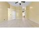 Spacious bedroom with tile floors and a ceiling fan, and ensuite bath entrance at 15123 Bald Eagle St, Tampa, FL 33625
