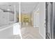 Inviting foyer with tile flooring, decorative columns, and an open view into the adjacent living spaces at 15123 Bald Eagle St, Tampa, FL 33625