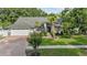 Charming single-Gathering home features a manicured lawn, mature trees, and a two-car garage at 15123 Bald Eagle St, Tampa, FL 33625