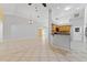 Open floor plan featuring tile floors, granite countertops, and stainless steel appliances at 15123 Bald Eagle St, Tampa, FL 33625