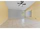 Open living room featuring tile flooring, vaulted ceiling, and windows offering natural light at 15123 Bald Eagle St, Tampa, FL 33625