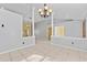Spacious living room with tile floors, neutral walls, and decorative pillars creating an open and airy feel at 15123 Bald Eagle St, Tampa, FL 33625