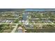 Stunning aerial view of the property with canal access and neighborhood at 15218 Appleton Blvd, Port Charlotte, FL 33981