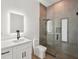 Modern bathroom features glass walk-in shower, LED mirror, and sleek fixtures at 15218 Appleton Blvd, Port Charlotte, FL 33981