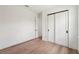 Empty bedroom showcasing hardwood floors and closet space at 15218 Appleton Blvd, Port Charlotte, FL 33981