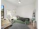 Charming bedroom is staged with bed, decor, and hardwood floors at 15218 Appleton Blvd, Port Charlotte, FL 33981
