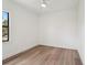 Empty bedroom showcasing natural light and hardwood floors at 15218 Appleton Blvd, Port Charlotte, FL 33981