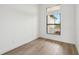 The empty bedroom provides ample space for living with a large window and neutral paint at 15218 Appleton Blvd, Port Charlotte, FL 33981