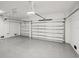 Spacious two car garage featuring epoxy flooring and white walls at 15218 Appleton Blvd, Port Charlotte, FL 33981