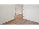 Hallway with neutral-colored walls and flooring provides a bright space between rooms in the home at 15218 Appleton Blvd, Port Charlotte, FL 33981
