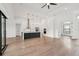 Contemporary kitchen boasts hardwood floors, sleek cabinetry, and a large center island at 15218 Appleton Blvd, Port Charlotte, FL 33981