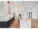 Beautiful kitchen features custom cabinetry, stainless steel appliances, and a large center island at 15218 Appleton Blvd, Port Charlotte, FL 33981