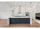 Modern kitchen with a large island, stainless steel appliances, and custom cabinetry at 15218 Appleton Blvd, Port Charlotte, FL 33981