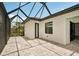 An inviting screened lanai area with tiled flooring at 15218 Appleton Blvd, Port Charlotte, FL 33981