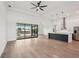 Open concept living space boasts hardwood floors, ample natural light, and a modern kitchen at 15218 Appleton Blvd, Port Charlotte, FL 33981
