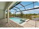 Inviting screened-in pool and spa overlooking lush tropical landscaping and waterfront views at 15218 Appleton Blvd, Port Charlotte, FL 33981