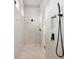 This large walk-in shower includes modern fixtures and a built-in niche for storage in the wall at 15218 Appleton Blvd, Port Charlotte, FL 33981