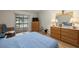 Serene bedroom with wood-look floors, a view of the water, and a cozy seating area for relaxation at 1709 Castle Rock Rd, Tampa, FL 33612