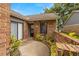 Inviting front entry with brick accents and a small garden area enhancing curb appeal at 1709 Castle Rock Rd, Tampa, FL 33612