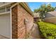 Brick exterior home with a pathway leading to the front entrance and lush green lawn at 1709 Castle Rock Rd, Tampa, FL 33612