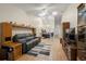 Open-concept living area with vaulted ceilings, wood-look tile floors, and a casual design at 1709 Castle Rock Rd, Tampa, FL 33612