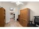 Bright room with wood-look flooring, a ceiling fan, and built-in wooden cabinets for ample storage at 1709 Castle Rock Rd, Tampa, FL 33612