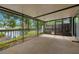 Relaxing screened patio offers peaceful water views and fresh air at 1709 Castle Rock Rd, Tampa, FL 33612