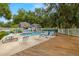 Inviting community pool area with lounge chairs, tables, and decking at 1709 Castle Rock Rd, Tampa, FL 33612