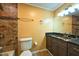 Bathroom with granite counter and unique stone tile at 17824 Morninghigh Dr, Lutz, FL 33549