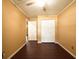 Bedroom features hardwood floors and double door closet at 17824 Morninghigh Dr, Lutz, FL 33549