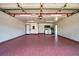 Spacious garage featuring a laundry area and painted floor at 17824 Morninghigh Dr, Lutz, FL 33549