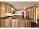 Beautiful kitchen with custom wood cabinetry and a black marble countertop at 17824 Morninghigh Dr, Lutz, FL 33549
