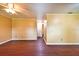 Spacious living room with hardwood floors and neutral walls, perfect for entertaining guests at 17824 Morninghigh Dr, Lutz, FL 33549