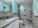 Bathroom featuring a tiled shower, granite countertop, and modern sink at 200 Country Club Dr # 202, Largo, FL 33771