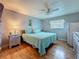 Bedroom featuring a bed with light blue linens and a ceiling fan at 200 Country Club Dr # 202, Largo, FL 33771