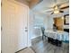 Well-lit dining room with a round table, modern light fixture, and neutral wall paint at 200 Country Club Dr # 202, Largo, FL 33771