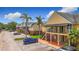 View of multiple apartment buildings with car parking and landscape at 200 Country Club Dr # 202, Largo, FL 33771