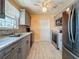 Modern kitchen features stainless steel appliances, sleek countertops, and neutral-colored cabinets at 200 Country Club Dr # 202, Largo, FL 33771