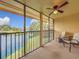 Screened porch overlooking serene waterfront view at 200 Country Club Dr # 202, Largo, FL 33771