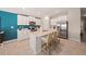 Modern kitchen with white cabinets, stainless steel appliances, and a large center island at 20214 Banner Ave, Port Charlotte, FL 33952