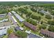 Wide aerial shot showcases the property near a golf course and surrounding residential neighborhood at 214 Caryl Way, Oldsmar, FL 34677